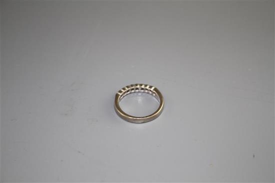 A modern 18ct white gold and ten stone diamond chip set half eternity ring, size M, gross weight 4.5 grams.